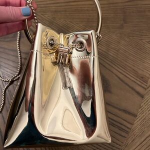 JIMMY CHOO gold metallic bucket bag w/round ring handle